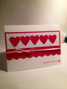 a card with red hearts on it