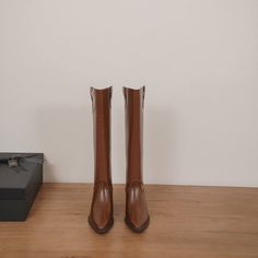 Looking for a stylish and sophisticated boot that will take your look to the next level? Then check out our Brown Block Heel Knee High Boots! These amazing boots are made from premium leather and feature a sleek pointed toe design. They're perfect for dressing up or down. and they'll add a touch of elegance to any outfit. Plus. the comfortable block heel makes them ideal for walking and standing all day. Upper: Leather/Suede Lining: Leather Outsole: TPR Toe: Pointed Toe Closure: Zip Heel: 5cm/2' Faux Leather Martin Boots For Fall Workwear, Fall Workwear Martin Boots In Faux Leather, Brown Martin Boots With Reinforced Heel And Pointed Toe, Brown Pointed Toe Chelsea Boots For Business, Fall Wide Calf Pointed Toe Knee-high Boots, Brown Pointed Toe Martin Boots, Pointed Toe Mid-calf Boots For Office In Fall, Fitted Leather Knee-high Martin Boots, Office Boots For Fall With Pointed Toe