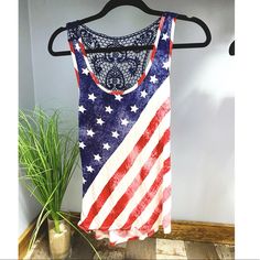 Brand New From Rue21. Flag Tank With Lace Back Detail. Size Is Xs. White Tops With American Flag Print For Beach, White American Flag Print Top For The Beach, White American Flag Print Tops For Beach, White American Flag Print Top For Beach, White Americana Tops For Summer, White Americana Style Tops For Summer, Red Tops With American Flag Print For Spring, Red Flag Print Tank Top For Summer, Red Sleeveless Tank Top With Flag Print