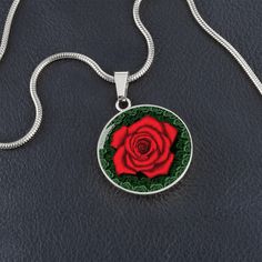 Red Rose Circle Pendant Necklace The Red Rose Circle Pendant Necklace is a beautiful and meaningful gift that can be given to that special person in your life. Whether it's your significant other, your best friend, or a family member, expressing love and support is always important, especially when they're going through a tough time. The red rose pendant is a symbol of many things such as romance, love, beauty, passion, and courage. It's a powerful reminder that love can conquer all, and that th Expressing Love, We Are Strong, Circle Pendant Necklace, Luxury Necklace, Glass Coating, Rose Pendant, Love Can, Circle Pendant, Significant Other