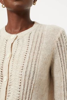 An incredibly cozy throw-on-and-go pieceKnitted from a wool blend with a touch of mohair for added softness and texture, the Champagne Addison Cardigan is delicate and warm all at once with it's open lace stitch detail. Wear this as a sweater with your fav jeans or layered over a blouse or a dress. Our Favorite Details: Open lace stitch detail Ribbed finishes Slightly cropped silhouette Material: 40% Wool, 20% Cotton, 19% Polyamide, 15% Acrylic and 6% MohairCare: Dry clean About the BrandWe love Pointelle Knit Cardigan For Layering, Elegant Knitted Cardigan For Layering, Classic Pointelle Knit Cardigan For Fall, Elegant Pointelle Knit Sweater For Layering, Elegant Cream Cable Knit Cardigan, Elegant Mohair Cardigan For Layering, Winter Pointelle Knit Cardigan For Layering, Beige Pointelle Knit Cardigan, Cream Mohair Cardigan For Fall