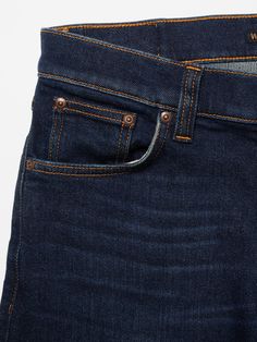 Tight-fit jeans in a deep, dark wash, featuring sharp yet subtle wear marks. Crafted from deeply saturated denim, these jeans exhibit a rustic, three-dimensional texture. The wash enriches the indigo's depth, while the wear subtly adds contrast and a worn-in appearance, giving these jeans a clean yet subdued look. Dark Wash Mid-rise Jeans With Hip Pockets, Mid-rise Dark Wash Jeans With Hip Pockets, Dark Wash Flare Jeans With Belt Loops, Dark Wash Jeans With Hip Pockets, Dark Wash Mid-rise Selvedge Jeans, Classic Dark Wash Pants With Hip Pockets, Classic Dark Wash Jeans With Hip Pockets, Classic Dark Wash Jeans With Standard Cut Leg, Dark Wash Straight Selvedge Jeans