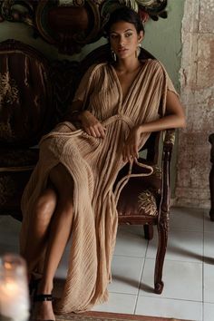 An iconic introductory piece from our premiere collection, the Grecian-inspired Athena Gown is an effortless kaftan-dress combination which transforms from comfort to glam with the simple tie of a braid. Designed, in classic Kasia Kulenty style, to be worn in a multitude of ways - flowy and ethereal, classically chic in an empire waist, wrapped and tied at the shoulders to create our constructed Selena-effect straps, or even backwards!We encourage you to play with the signature braided detailing Goddess Style Outfits, Pleated Fabric Dress, Goddess Look, Greek Goddess Dress, Goddess Fashion, Goddess Gown, Athena Goddess, Goddess Dress, Pleated Fabric