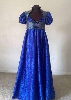 Hello!  I am currently doing sales outside of etsy.  Please contact desree10@yahoo.com and I can accept cards thru paypal and venmo for a 10% discount of the listed price. Thank you! This vibrant, elegant gown is the perfect ensemble for this years' renaissance or regency era events! The full-length, royal blue dress is a beautiful lightweight crushed taffeta that can be machine washed and  dried.  The neckline is elasticized and can be pulled low off the shoulders and easily adjusted to your de Blue Regency Gown, Regency Evening Dress, Regency Gown Ball, Blue Satin Dress For Costume Party, Blue Fantasy Dresses For Fantasy Events, 2024 Gowns, Bridgerton Inspired Dress, Regency Ball Gown, Regency Era Dress