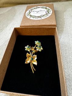 Sweet vintage "Forget me Not" Brooch, Yellow metals set with blue & green crystal, 4 cm by 2.5 cm, in good vintage condition. Green Enamel Brooch Pin As Gift, Green Brooch Enamel Pin For Gift, Vintage Flower Lapel Pin Gift, Vintage Flower Lapel Pin For Gift, Green Enamel Pin Brooch For Gift, Antique Green Brooches For Anniversary, Antique Green Brooch For Anniversary, Vintage Brooch Lapel Pin Gift, Vintage Brooch Lapel Pin For Gift