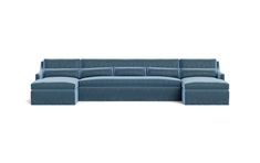 a blue sectional couch sitting on top of a white floor