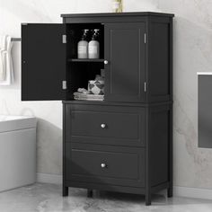 a bathroom cabinet with two bottles and soaps on the top, next to a toilet