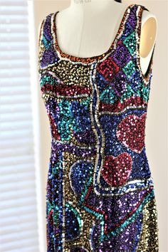 "Beautiful and fun Vintage sequin dress by Oleg Cassini Black Tie. This dress is a classic shift dress, with a patchwork style pattern and all kinds of fun sequins. Love the hearts in this one!! Excellent condition!! Measuring: 38\" length Bust: 38\" Waist: 32\" Hip: 40\" Pet Free/smoke free Enjoy!" Vintage Sequin Dress, Oleg Cassini, Heart Beads, Beaded Dress, Black Tie, Sequin Dress, Shift Dress, Sleeveless Dress, Sequin