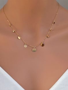 14k gold filled or 925 sterling silver or rose gold delicate coin disc necklace Perfect looking on its own or layering with other dainty necklaces. It makes of.. -9,7,6, and 3.8mm Sterling Silver or 14k gold fill disc attach -Sterling Silver or 14k gold fill cable chain with spring claw. -Come up with beautiful ribbon gift box that enhance your present ... It could be 925 Sterling Silver or 14k Gold Fill GOLD COINS https://www.etsy.com/listing/258733697/gold-coin-necklace-sterling-silver-coin?re Coin Choker, Gold Coin Necklace, Chain Extenders, Disc Necklace, Coin Necklace, Silver Coins, Drop Necklace, Dainty Necklace, Gold Filled Jewelry