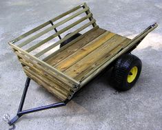 a wooden cart with wheels on the ground