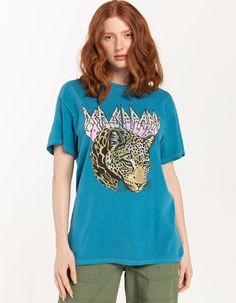 Goodie Two Sleeves Def Leppard Boyfriend Tee. Large Graphic Screened On Front. Ribbed Crew Neckline. Short Sleeve. Contrast Stitching. Oversized Fit. 100% Cotton. Machine Wash. Imported. Model Is Wearing A Size Small. Model Measurements:height: 5'7" Bust: 32"waist: 25"hips: 37" Oversized Leopard Print Top, Leopard Print Graphic Crew Neck Top, Leopard Print Relaxed Fit T-shirt With Crew Neck, Leopard Print Relaxed Fit Short Sleeve Tops, Relaxed Fit Leopard Print Tops With Short Sleeves, Leopard Print Short Sleeve Top With Relaxed Fit, Leopard Print Tops With Relaxed Fit And Short Sleeve, Casual Leopard Print Top With Relaxed Fit, Relaxed Fit Leopard Print Graphic T-shirt