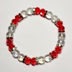 Crystal Beaded Stretch Bracelet Handmade By Me Red Faceted Crystal Beads Clear Iridescent Glass Beads Red Rhinestone Accents 7.5 Length New Elegant Red Crystal Bracelet With 8mm Beads, Elegant Red Hand-strung Stretch Bracelet, Adjustable Red Crystal Bracelets, Adjustable Red Crystal Bracelet, Red Faceted Beads Bracelet, Elegant Red Stretch Bracelet With 8mm Beads, Traditional Red Faceted Beads Bracelet, Red Beaded Bracelets With Spacer Beads For Party, Red Crystal Bracelet With 8mm Beads