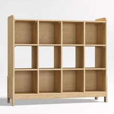 a wooden bookcase with multiple compartments on each side