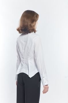 Our timeless crisp White Pima Cotton shirts are check the boxes of form and function. This season the Beam Shirt is reinvented as a bit of a shirt jacket. A shaped body which has a scalloped bottom and back with some asymmetric detail on each side. Destined to become a MATTHILDUR classic. Timeless Tailored Tops For Office, Timeless Slim Fit Tops For Office, Timeless Slim Fit Office Tops, Timeless Fitted Tops For Workwear, Timeless Fitted Tops For Work, Timeless Fitted Top For Business Casual, Timeless Tops With Buttons And Fold Down Collar, Timeless Fitted Top For Office Wear, Timeless Slim Fit Button-up Tops