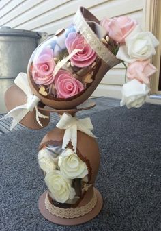 a vase filled with flowers sitting on top of a table