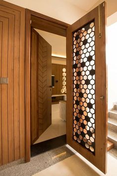 an open door leading to a bathroom with wood paneling