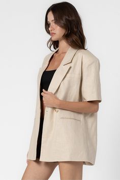 Half length sleeves Classic lapel collar One-button closure Single breast pocket Back vent Lined Fits oversized. Model measurements: Height 5'9", Bust 30.5", Waist 23.5", Hips 33.5" | Wearing a S/M. 85% Linen, 15% Cotton | Lining : 100% Polyester Oversized Blazer With Button Closure And Suit Collar, Summer Blazer With Hidden Button Closure, Oversized Button-up Blazer For Business Casual, Summer Outerwear With Suit Collar And Pockets, Oversized Button-up Blazer, Oversized Spring Blazer With Button Closure, Classic Summer Outerwear With Lapel Collar, Single Button Summer Outerwear With Suit Collar, Single Button Outerwear With Suit Collar For Summer