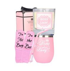 a pink gift set includes a candle, gloves and a box with the words i'm not the busy boss printed on it