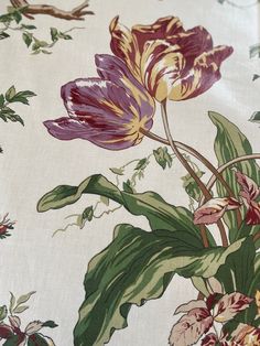 an image of a flower pattern on a tablecloth that is white and has purple flowers