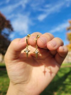 Materials:  Hoop- stainless steel (in gold color) Charm- 18k gold plated CZ star drop Item Details: The earrings are for 1 PAIR and only come in the CLIP ON version for NON PIERCED ears. These stainless steel clip on hoop earrings use a spring closure and look very realistic (like pierced earrings).  US customers: Receive FREE US shipping by making an order of $35 or above from my shop. Non-US customers: If you order multiple items from my shop at once, the shipping cost will be for one piece. I Clip On Earrings Dangle, Dangly Clip On Earrings, Clip On Dangle Earrings, Aesthetic Clip On Earrings, Gold Stainless Steel Jewelry With Star Charm, Gold Plated Star Shaped Hoop Earrings, Gold Plated Star-shaped Hoop Earrings, Gold Celestial Dangle Huggie Earrings, Tarnish Resistant Star-shaped Everyday Earrings