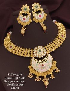 Description :- Gold Choker Necklace/ South Indian Jewelry/Choker/ Temple Necklace /Antique Gold choker Necklace/Indian Wedding Jewelry Gift yourself a royal look with this perfectly crafted kundan necklace set from Manalisstudio. Crafted with high quality kundan stones and pearls, it is impressive in design. The green enamel artwork adds perfect texture to the design. Perfect for weddings and festivities, this antique necklace set should be put on with your favorite sari or lehenga. 100% Satisfa Gold Choker Necklace Indian, Indian Jewelry Choker, Choker Necklace Indian, Temple Necklace, Indian Choker Necklace, Necklace Indian, South Indian Jewelry, Necklace Antique, Indian Wedding Jewelry