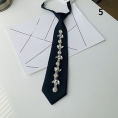 Please note this is in Asian sizing, smaller than western size e.g. UK, US, AU. Please check the measurements carefully before making a purchase. Please allow 2-4cm discrepancy due to different measurement method. 1X Unisex Ties Necktie Accessory Faux Pearl Rhinestone Crystal Glitter Necktie  1: 38 * 5 cm/14.9 * 2.0 in 2: 28 * 5 cm/11.0 * 2.0 in 3: 28 * 5 cm/11.0 * 2.0 in 4: 35 * 5 cm/13.8 * 2.0 in 5: 35 * 5 cm/13.8 * 2.0 in Material: polyester Color: as shown in the pictures Please allow slight Evelyn Core, Necktie Crafts, Tie Ideas, Chanel Jackets, Tie Crafts, Upcycle Clothes Diy, Personalized Tie, Silver Tie, Make Your Own Clothes