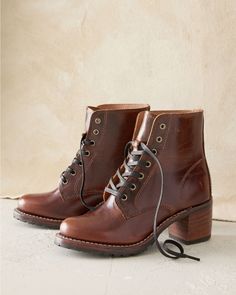 Handcrafted in the USA, this vintage-inspired lace-up boot is throughly modern in water-resistant waxed Horween leather from Chicago with a durable Vibram lugged sole and comfy Goodyear welt construction. Featuring a stacked leather heel for extra height, plus metal eyelets and fabric laces for extra style. By Frye. Lace-up style. Leather-wrapped footbed. Man-made sole and heel cap. USA. Fall Thrifting, Eileen Fisher Shoes, Shop Boots, Horween Leather, Garnet Hill, Heel Caps, Swag Shoes, Goodyear Welt, Sweater Sale