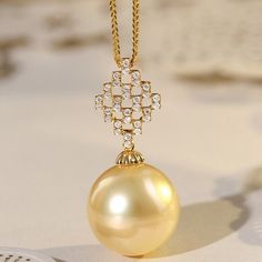 * Condition: Brand new * Center Stone: Natural Golden South Sea Pearl 13-14mm * Side Stone: Natural White Diamond, Round Cut, approx 0.15ct (VVS clarity with F color)  * Pearl Shape Grade: Perfectly Round * Metal Purity: 18K Solid Yellow Gold * Necklace Chain Length: 40-45cm (adjustable) * Superior pearls standard - 99% of the pearl surface is clean. An extremely detailed and up-close study of the pearl is needed to find imperfections. * The item will be gift wrapped and shipped. --------------- Luxury Yellow Gold Refined Pearl Necklace, Elegant Gold Round Pearl Necklace, Luxury Yellow Gold Diamond Necklace, Exquisite Gold Diamond Necklace For Formal Events, Luxury High Luster Necklaces For Formal Occasions, Exquisite Yellow Gold Diamond Necklace For Formal Occasions, Luxury Yellow Gold Necklace With High Luster, Exquisite Yellow Gold Pendant Pearl Necklace, Luxury Necklace With Pearl Pendant For Everyday