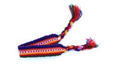 multicolored bracelet with tassels on white background