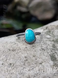 || Rose cut Arizona Turquoise + Sterling Silver || Size 6.5 A great little stackable Turquoise ring that is an adorable stand alone or worn with other rings. This ring is for those who love subtle pieces and is designed with a dainty beaded setting in Sterling silver to give it a carefree wanderer feel to the design. The simple beaded setting makes this ring a great add to a dressy outfit or worn out to the beach.  The ring is finished off with one of my handmade textured branch ring bands, it is lightweight and very comfortable  A great everyday piece. || Shipping || All orders come with 1-3 day USPS shipping + insurance. Please note that carrier gives a shipping time average ESTIMATE not a guarantee. || Please note || All of my photos are taken in outdoor, natural light, in direct sunlig Dainty Turquoise Stackable Ring, Turquoise Stackable Toe Rings, Handmade Turquoise Stackable Rings In Sterling Silver, Turquoise Gemstone Stackable Promise Rings, Turquoise Stackable Ring For Promise, Adjustable Turquoise Gemstone Stackable Rings, Turquoise Stackable Promise Ring, Everyday Turquoise Ring With Gemstone, Dainty Blue Turquoise Stackable Ring