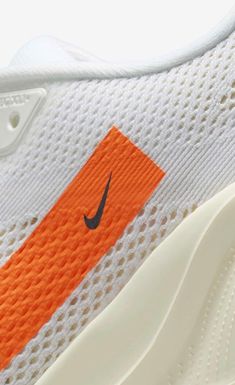 the nike zoom flyknit is an orange and white shoe