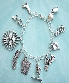 this charm bracelet features california inspired Tibetan silver charms(nickel free).the charms are attached to a silver tone 7.5 inches chain bracelet Symbolic Charm Bracelet With Dangling Charms, Symbolic Metal Charm Bracelet With Dangling Charms, Nickel Free Silver Themed Charms, Themed Sterling Silver Charms, Nickel-free Silver Themed Charms, Nickel-free Themed Silver Charms, Silver Symbolic Bracelets With Dangling Charms, Themed Silver Sterling Charms, Symbolic Silver Bracelets With Dangling Charms