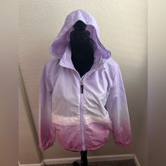 New With Tags. Youth Girls Ombr Pink And Purple Windbreaker In Woven Fabric With A Stand-Up Collar, Detachable, Lined Hood And Zip Down The Front With An Anti-Chafe Chin Guard. Flap Front Pockets And Covered Elastication At The Cuffs And Hem. Lined. Measurements: Length 23”, Pit To Pit 19.5” Purple Windbreaker, Light Ombre, Collar Detachable, Anti Chafing, H&m Jackets, Pink Ombre, Pink And Purple, Windbreaker Jacket, Kids Jacket