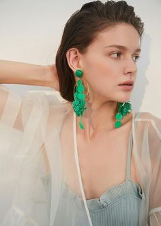 Be bold and make a statement with our Green Hoop Disc Drop Earrings! These striking earrings feature a big hoop design with a disc drop, adding a unique touch to any outfit. Perfect for confident women who want to add a daring touch to their style. 5 6/8" (14.5cm) drop 2 3/8" (6cm) width Post back Alloy, plastic Women's drop earrings Item #452802