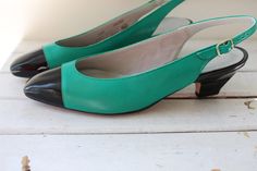 "dreamy black and green size 7.5 women EXCELLENT vintage condition leather deliso brand 1980s these are just lovely! 9 3/4\"tip to tip (taken from inside shoe) 3\"ball 2\"heel Thank YOU and please feel free to ask me any ?s:) Have a lovely day!! xoxo www.etsy.com/shop/retroandme" Retro Green Closed Toe Heels, Green Closed Toe Retro Heels, Green Retro Closed Toe Heels, Green Leather Low Heel Slingback Pumps, Formal Green Closed Toe Slingback Pumps, Vintage Almond Toe Green Heels, Vintage Green Almond Toe Heels, Green Low Heel Retro Heels, Vintage Green Heels For Formal Occasion