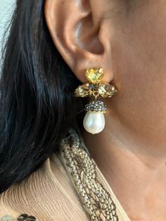 Prepare yourself for the festive season ♥️ Stylish Pearl and Crystal Earrings. The material is brass with gold plating and stones  Weight: 18 grams a pair Length: 4.5 cm Width: 2.5 cm Prong Setting Push Back Closure  Can go well with both Indian and Western wear. Elegant Jeweled Danglers For Celebrations, Gold-plated Jeweled Drop Crystal Earrings, Elegant Jeweled Pearl Earrings For Festive Occasions, Yellow Gold Clip-on Earrings For Party, Gold Clip-on Bridal Drop Earrings, Yellow Gold Clip-on Party Earrings, Yellow Gold Brass Clip-on Earrings For Party, Gold Jeweled Clip-on Earrings For Anniversary, Gold Clip-on Plug Earrings For Party