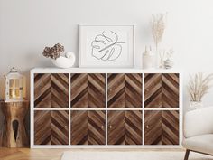 a white chair and a wooden cabinet in a room