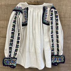 beautiful handmade 1980s traditional folk Romanian blouse with floral detailed embroidery  made in ARAD Transylvania , Romania  hemp size S/M Each item is special and unique so may have beautiful little imperfections :) message me if you have any questions xx Fall Festival Blouse With Floral Embroidery, Fall Festival Floral Embroidered Blouse, Folk Style Floral Embroidery Top For Fall, Traditional Peasant Top With Floral Embroidery For Fall, Traditional Fall Peasant Top With Floral Embroidery, Traditional Cotton Top With Embroidered Sleeves, Traditional Long Sleeve Peasant Top With Geometric Embroidery, Folk Style Embroidered Top For Fall, Folk Style Tops For Fall Festival