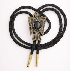 "Thunderbird Phoenix Bolo Tie with black stone, antique gold, Choose Black or Red 35\" Cord, 56mm, Each 57mm pendant Made in USA You choose black or red 36\" cord. handmade jewelry" Elegant Black Jewelry With Antique Finish, Vintage Black Jewelry With Antique Finish, Adjustable Western Gold Jewelry, Adjustable Gold Western Jewelry, Black Vintage Oxidized Jewelry, Vintage Oxidized Black Jewelry, Black Metal Jewelry With Antique Finish, Adjustable Black Brass Necklaces, Vintage Black Bolo Ties For Gift