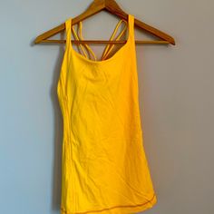 Bright Yellow Tight Lululemon Tight Tank Top Never Worn Yellow Stretch Sleeveless Activewear, Yellow Fitted Tank Top For Sports, Yellow Sports Tank Top, Yellow Stretch Racerback Activewear, Yellow Stretch Activewear With Light Support, Fitted Yellow Tank Top For Workout, Yellow Athleisure Tops For Yoga, Yellow Fitted Sportswear Top, Fitted Yellow Sportswear Top