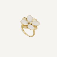 Refined cocktail ring that stand out for their wearability and style. 18K yellow gold flower, finely engraved using an ancient Florentine technique, is embellished by a prong-set brilliant-cut diamond. Luxury White Flower Shaped Ring, Luxury White Flower-shaped Ring, Luxury Yellow Gold Flower Ring With Gemstone, Luxury Flower Shaped Ring With Rose Cut Diamonds, Luxury Yellow Gold Flower Ring For Anniversary, Luxury Formal Flower-shaped Ring, White 14k Gold Flower Ring Fine Jewelry, Delicate Gold Flower Ring With Gemstone, Luxury Yellow Gold Hallmarked Flower Ring