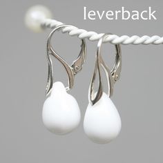 "Designed with czech glass briolette beads in opaque white color in a shape of drop. Ear wires: sterling silver 925 (European quality - we only use European silver!) You can choose: - regular hook ear wires - leverback Silver finish of earwires: - sterling silver 925 - 24K gold coated silver - black rhodium coated silver - rose gold coated silver * Total length of earrings is 28mm (1.1\") * Weight of each earring is about 2,2-2,4gr. Due to it is glass there can be bubbles inside teardrops. You w Classic White Drop Earrings, Delicate White Teardrop Earrings, Delicate White Dangle Teardrop Earrings, Classic White Teardrop Sterling Silver Earrings, Classic White Sterling Silver Teardrop Earrings, Delicate White Teardrop Dangle Earrings, Elegant White Drop Teardrop Earrings, White Modern Drop Earrings, Minimalist White Teardrop Earrings