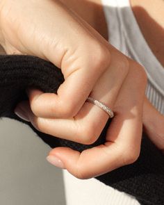 a close up of a person wearing a ring