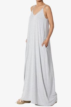 Embrace summer chic with this V-neck, jersey cami maxi dress.Designed for effortless elegance, it features adjustable straps for a perfect fit, and a draped, A-line silhouette that flatters every figure.Ideal for beach outings, festivals, or casual weekends, the lightweight fabric ensures comfort, while the bold color adds a dash of vibrancy to your day.Practical pockets and a relaxed fit make it a go-to for maternity wear or a casual day out. Pair it with strappy sandals and a bohemian-style tote to complete your cool summer ensemble.Trendy V-Neckline: A casual yet stylish maxi dress featuring a flattering V-neck, perfect for a day at the beach or a summer festival.Comfortable Jersey Fabric: Soft, stretch jersey ensures all-day comfort, making it a must-have for your travel and everyday w Casual Spaghetti Strap Maxi Dress For Loungewear, Casual Maxi Dress With Spaghetti Straps For Loungewear, Casual Sleeveless Maxi Dress For Loungewear, Stylish Maxi Dress, Jersey Maxi Dress, Cami Maxi Dress, Maxi Jersey Dress, Long Dress Casual, Summer Chic