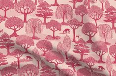 a pink background with trees and animals on it, as well as the height of the fabric