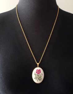 Royal Copenhagen necklace, pendant made of porcelain.  5 x 3.5 cm  (1.9 x 1.3") Chain is 60 cm (23.6") In very good condition. A-Grade (factory first) with no cracks and damages.  Comes completely with original box. Vintage White Jewelry With Pressed Flowers, Collectible White Locket Jewelry, White Oval Pendant Necklace With Locket, White Flower Pendant Locket Necklace, Hand Painted White Round Pendant Necklaces, White Hand Painted Round Pendant Necklaces, White Hand Painted Round Pendant Necklace, White Enamel Jewelry With Large Pendant, White Enamel Hand Painted Necklace