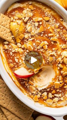 an apple pie dip in a bowl with crackers