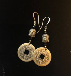 COIN EARRINGS These coin earrings are hand-made from brass replicas of old Chinese "cash" coins once used in China and East Asia.   Apart from their attractive shape, these coins conjure up human transactions over the centuries, the exchange of spices, silk and tea...they call to the past... to the time of Shanghai Lily.  The focal bead is a brass BUDDHA bead with black Swarovski crystal rondelle beads for a rich Old World effect.    DIMENSIONS For earring dimensions please see photo. GIFT These Buddha Beads, Meditation Gifts, Buddhist Monk, Coin Earrings, Boho Stil, Focal Bead, Feng Shui, Shanghai, Thoughtful Gifts