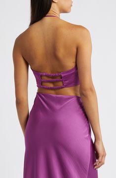 Capture glances in an alluring halter top designed with an open back and deep neckline highlighted by a polished O-ring. 15" length Halter neck Back elastic straps 100% polyester Machine wash, dry flat Imported Club Halter Top With Built-in Bra, Party Backless Halter Top With Built-in Bra, Satin Backless Halter Top For Date Night, Satin Halter Neck Top For Night Out, Glamorous Backless Halter Top For Date Night, Satin Tie Back Halter Top For Evening, Evening Satin Halter Top With Tie Back, Fitted Satin Halter Top For Date Night, Glamorous Halter Neck Top For Date Night