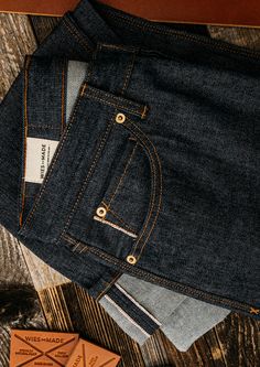 Standard cut with extra room in seat & thigh. Mid-rise 11”with slight taper to a 15” leg opening at size 33. American premium ring-spun cotton woven on vintage Draper looms makes our selvedge denim the real deal. At 14oz, our selvedge denim makes a rugged pair of jeans that over time will develop their own wear and fades authentic to you. 1/8th double needle stitching, custom brass rivets & buttons, hand stamped leather patch, 8oz soft twill pocket bags, tucked belt loops, clean finish and folde Taper Cut, Demin Jacket, Stamped Leather, Selvedge Denim, Raw Denim, Extra Room, Best Jeans, Pocket Bag, Chain Stitch